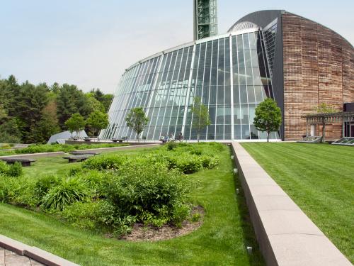 Large green roof with lawn, shrubs and walkways